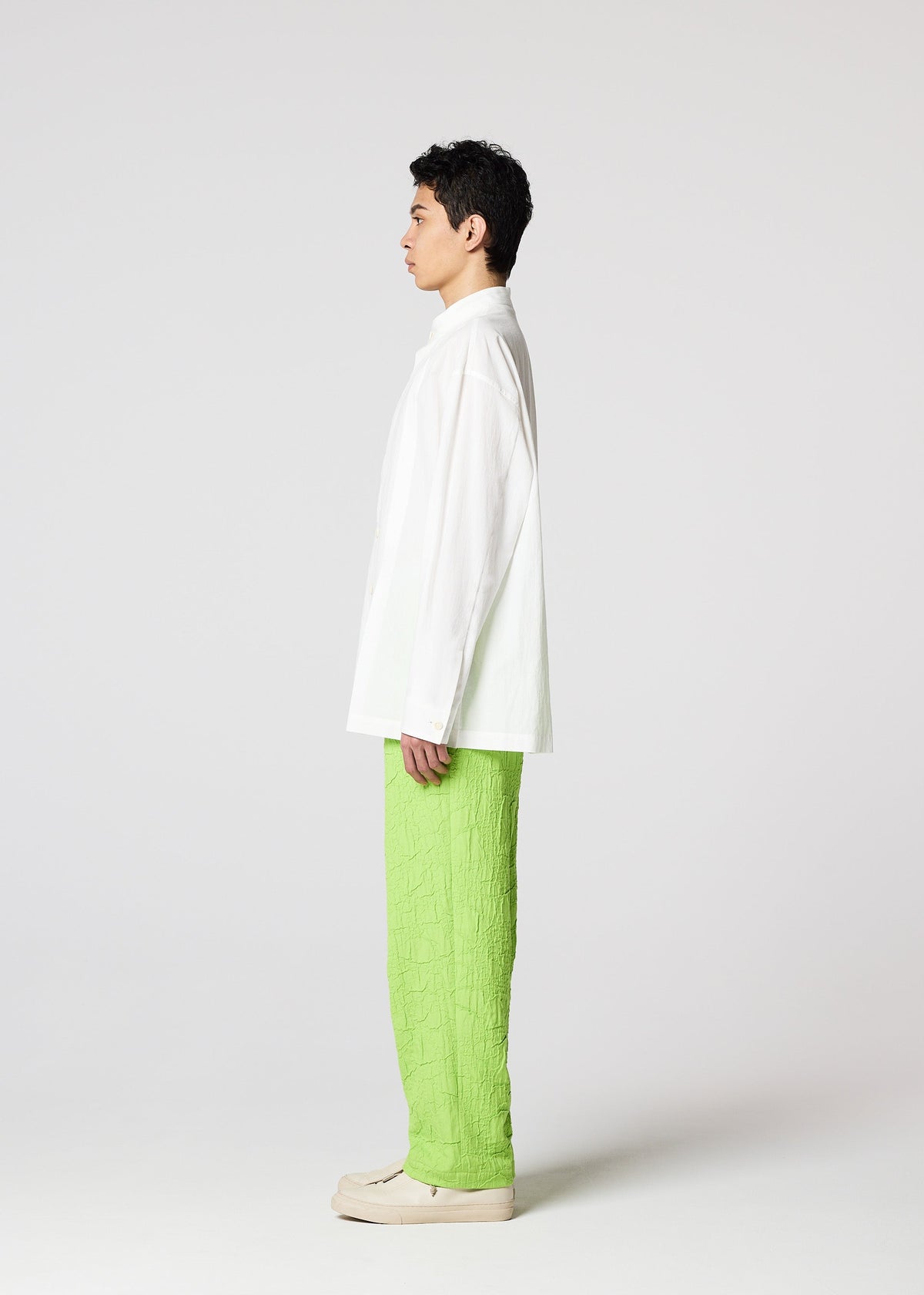 A model wears the IM MEN WHITE SHIRT clothing.