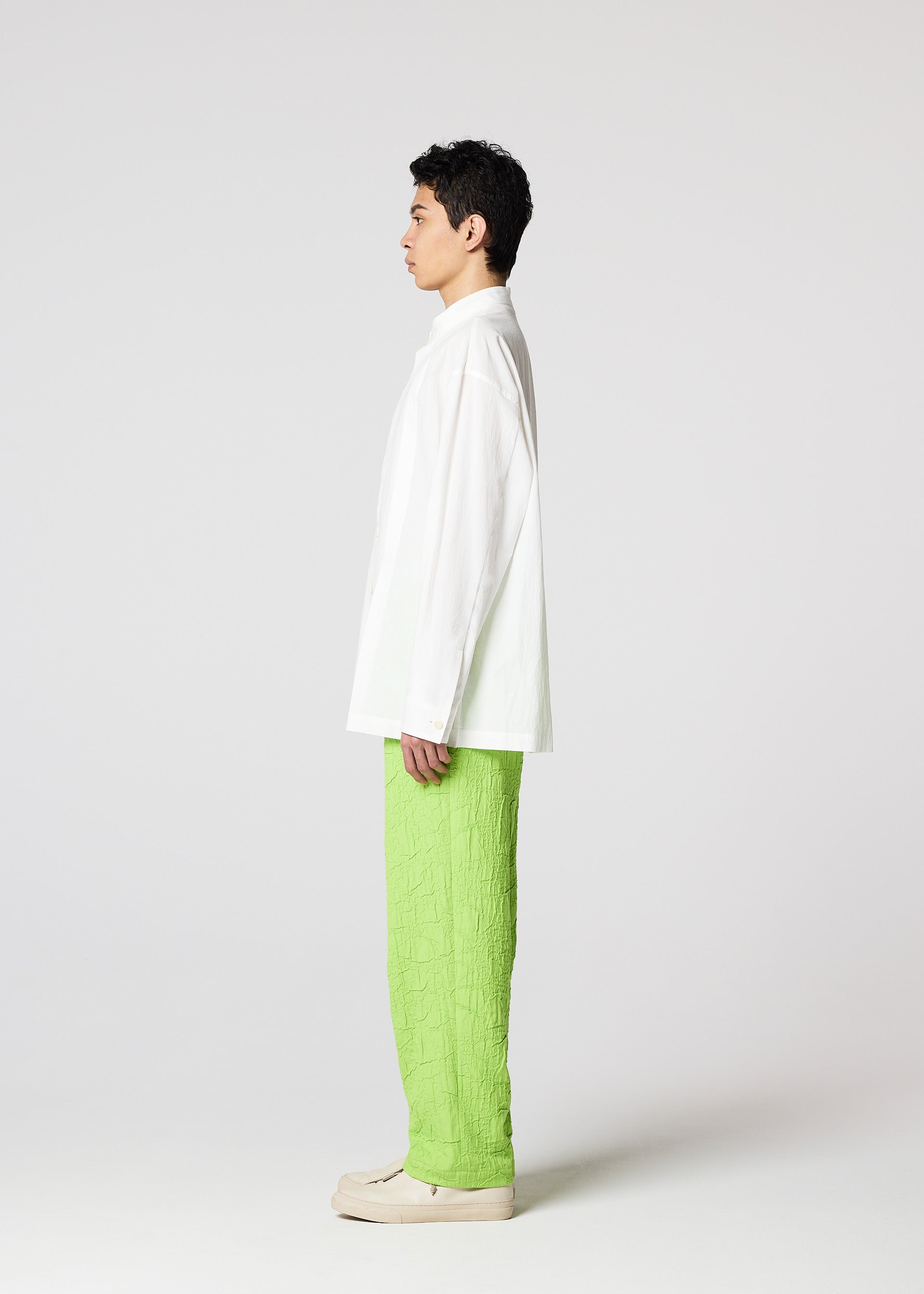A model wears the IM MEN WHITE SHIRT clothing.