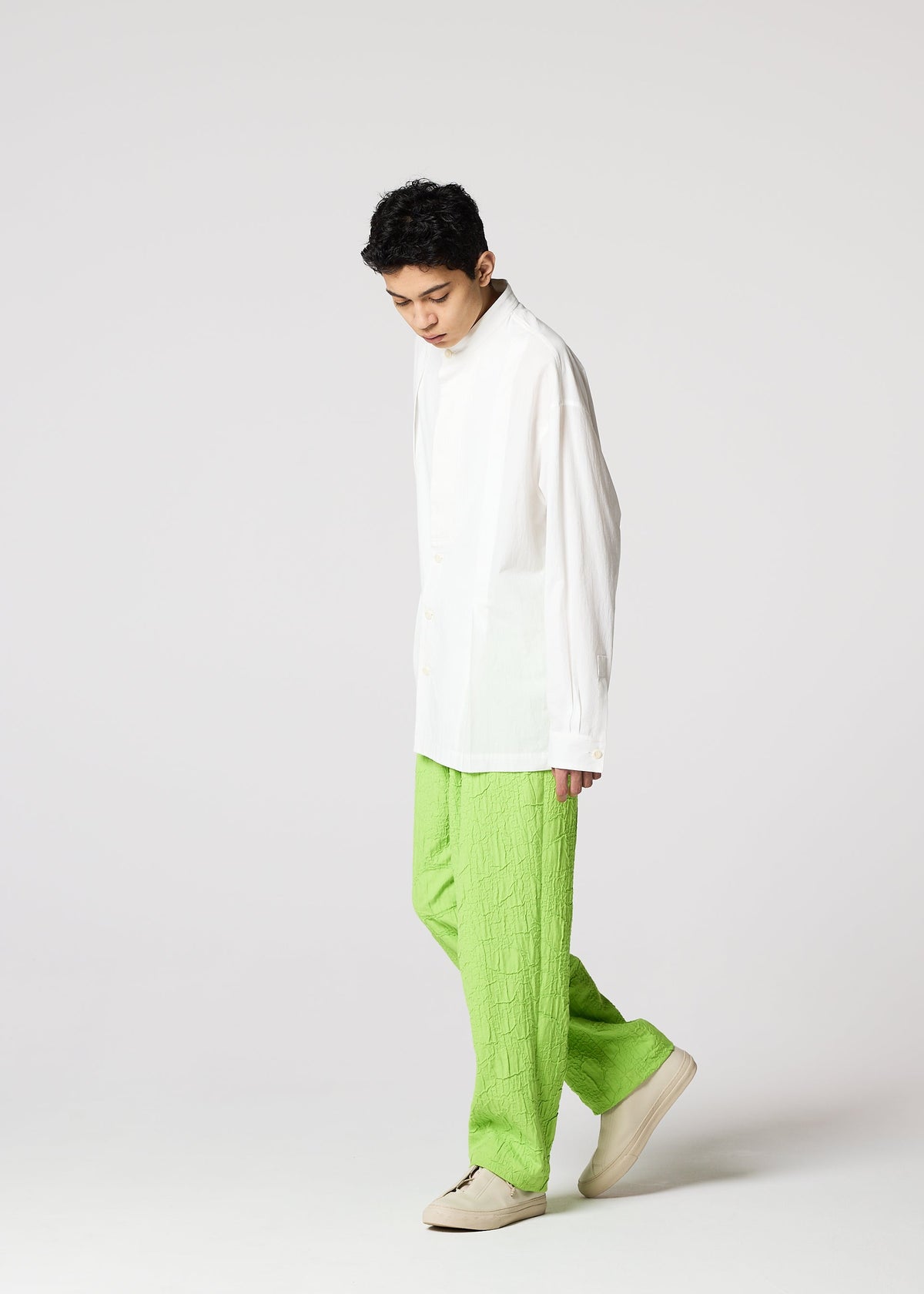 A model wears the IM MEN WHITE SHIRT clothing.