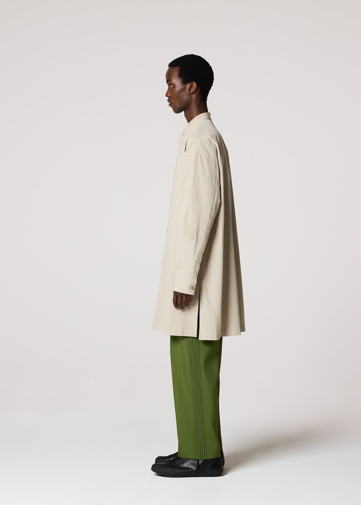 A model wears the IM MEN WHITE SHIRT clothing.