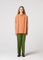 A model wears the IM MEN PLEATS SHIRT shirt.