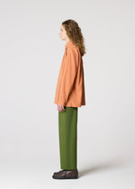 A model wears the IM MEN PLEATS SHIRT shirt.