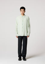A model wears the IM MEN STRIPE LINEN SHRINK shirt.