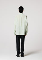 A model wears the IM MEN STRIPE LINEN SHRINK shirt.
