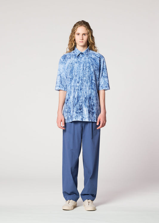 A model wears the IM MEN SPEC SHIRT shirt.