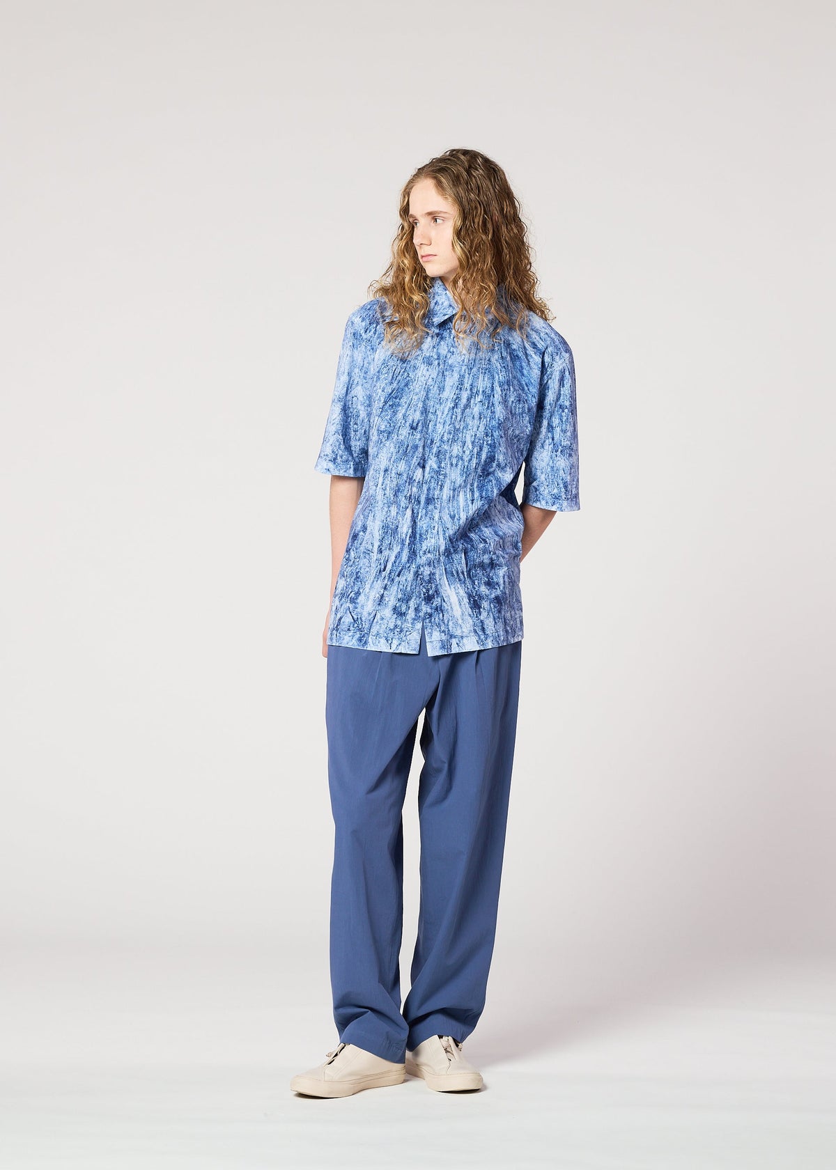 A model wears the IM MEN SPEC SHIRT shirt.