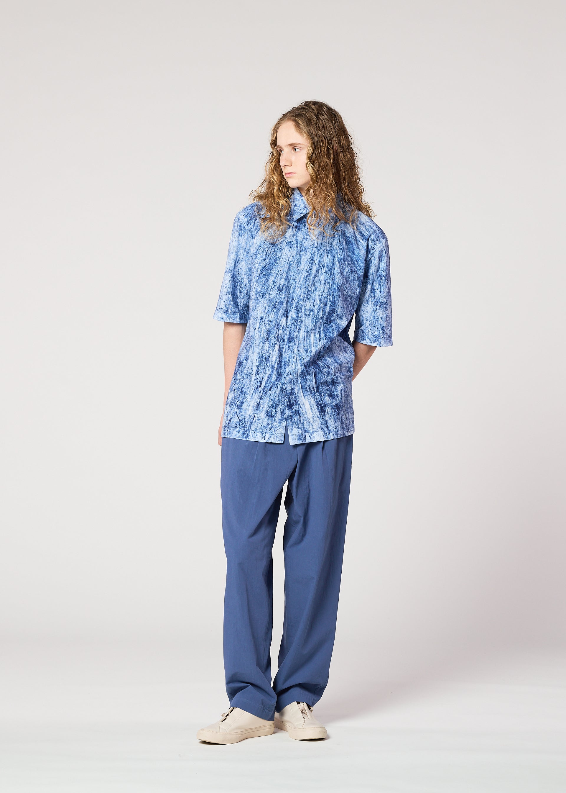 A model wears the IM MEN SPEC SHIRT shirt.