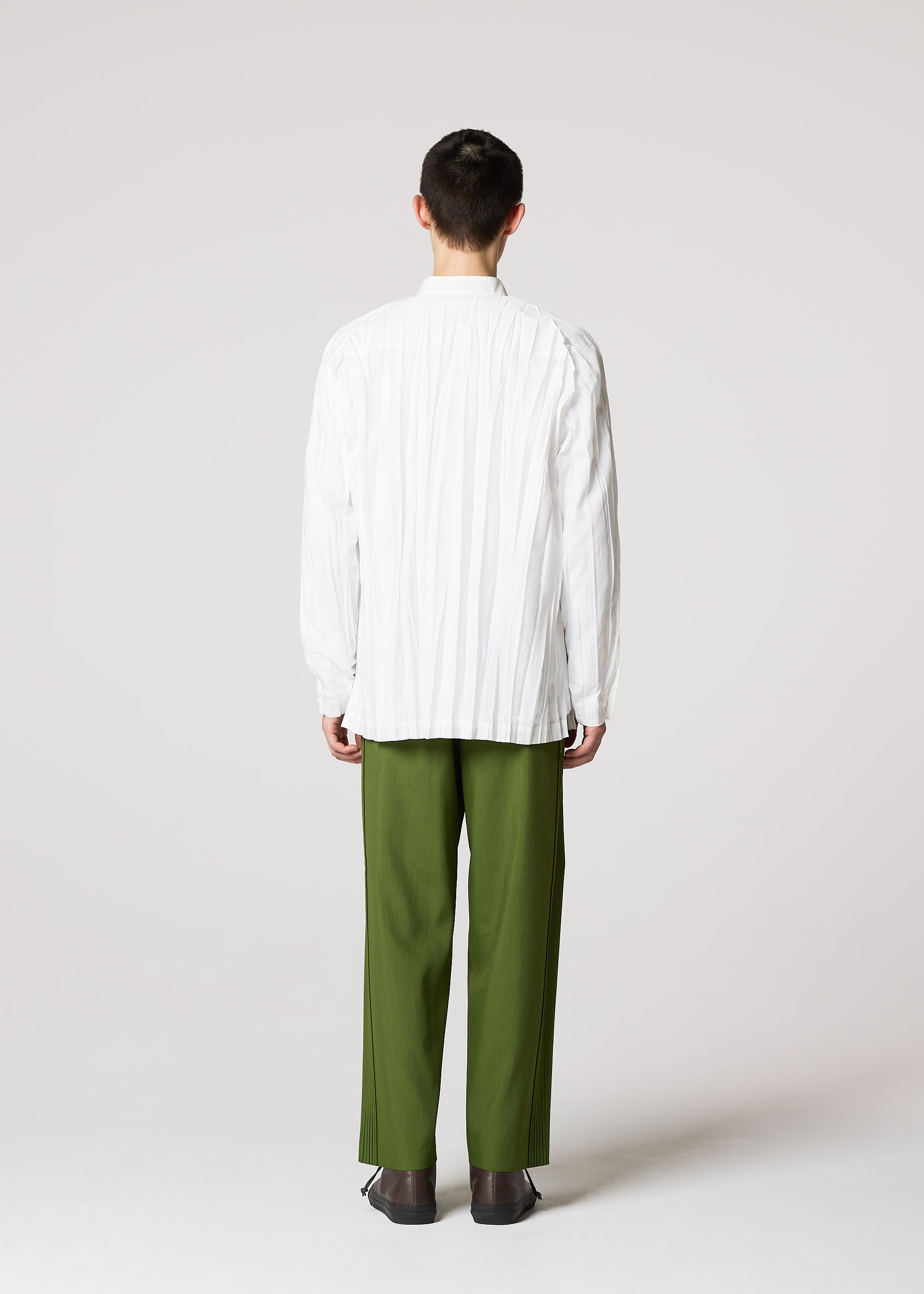 A model wears the IM MEN WRINKLE SHIRT shirt.