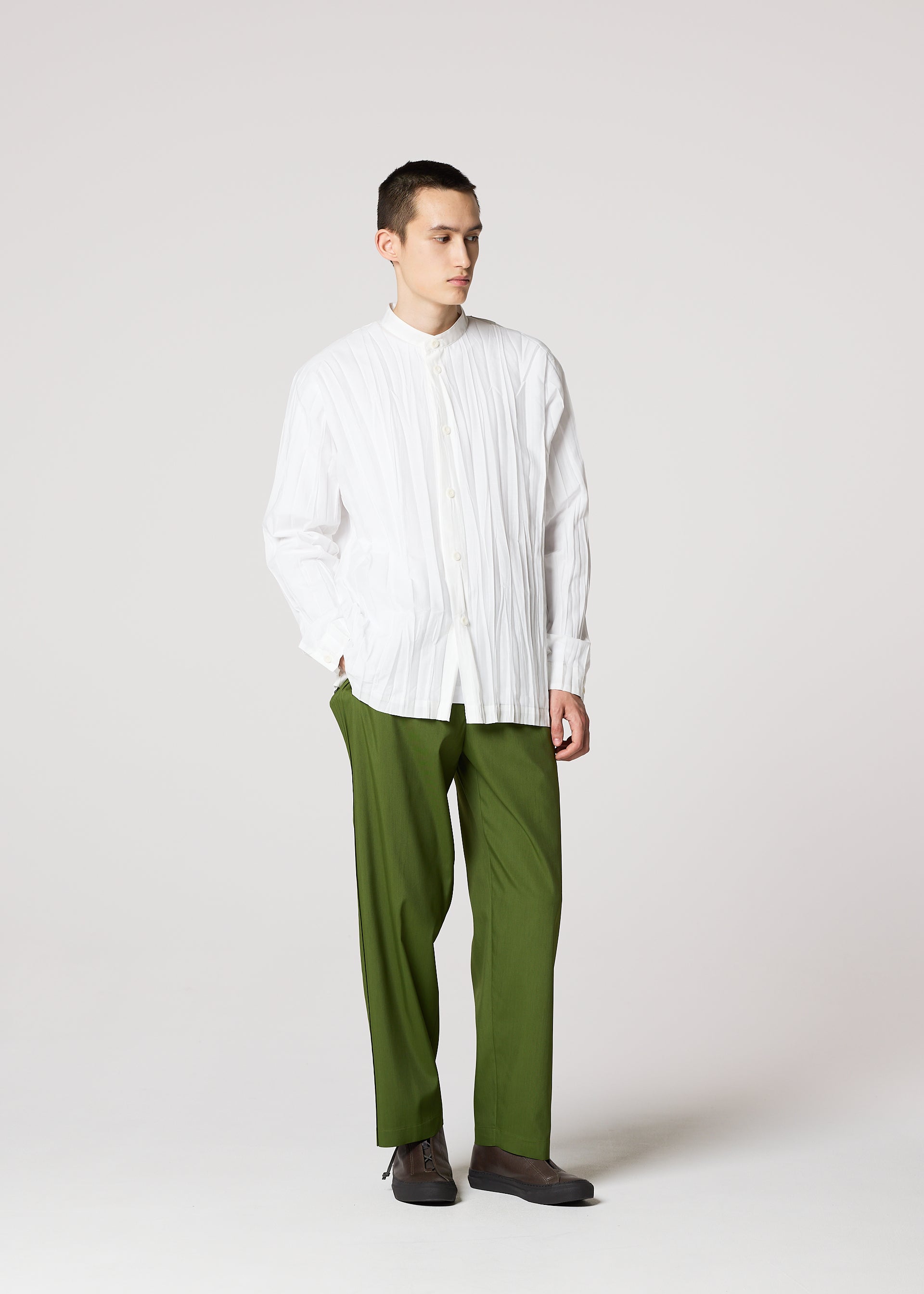 A model wears the IM MEN WRINKLE SHIRT shirt.