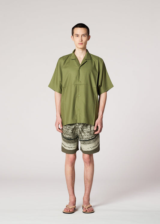 A model wears the IM MEN COMPACT SHIRT shirt.