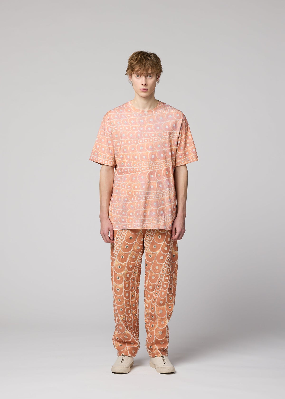 A model wears the IM MEN UROKOMON T top.