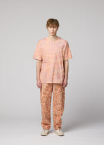 A model wears the IM MEN UROKOMON T top.
