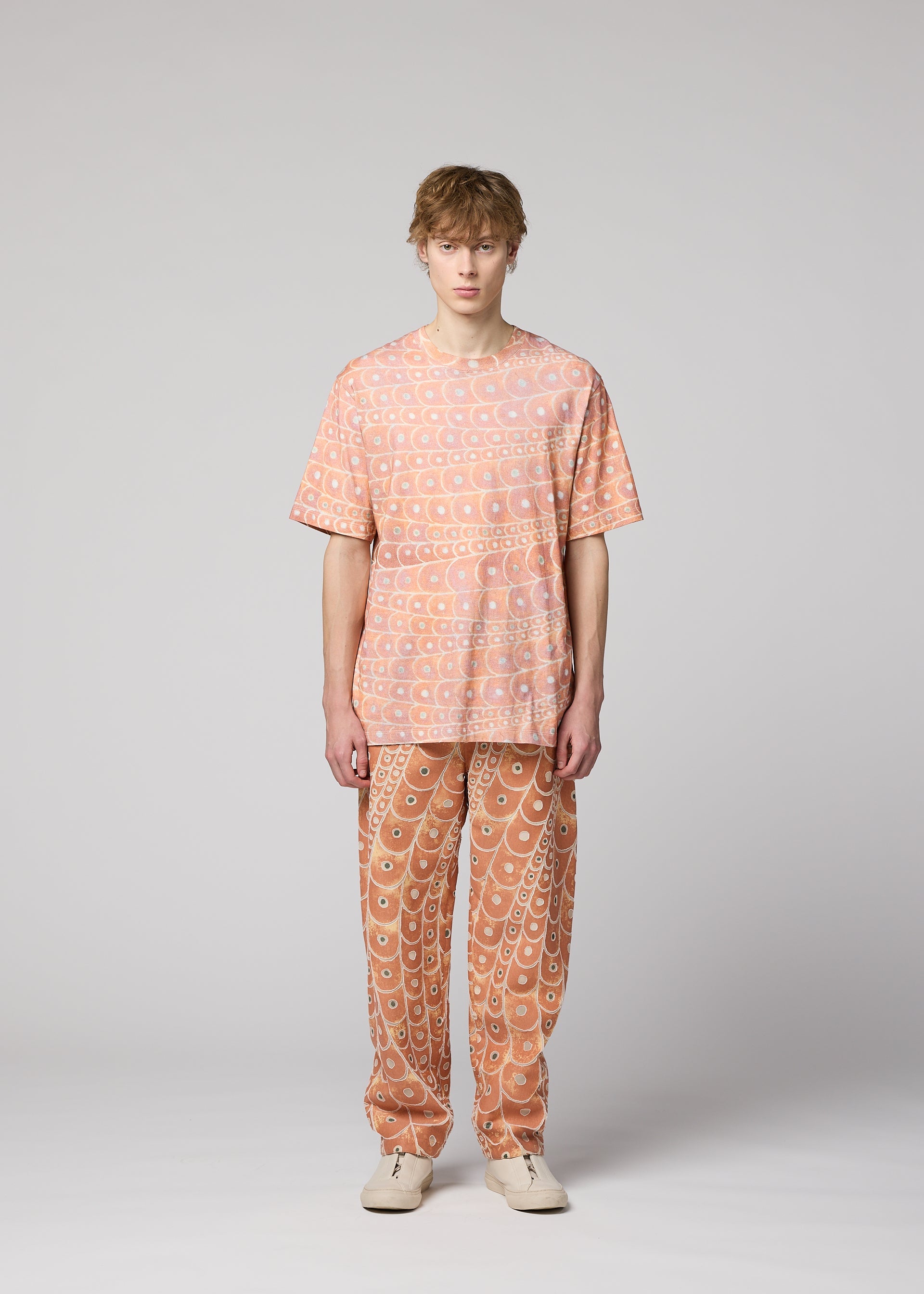 A model wears the IM MEN UROKOMON T top.