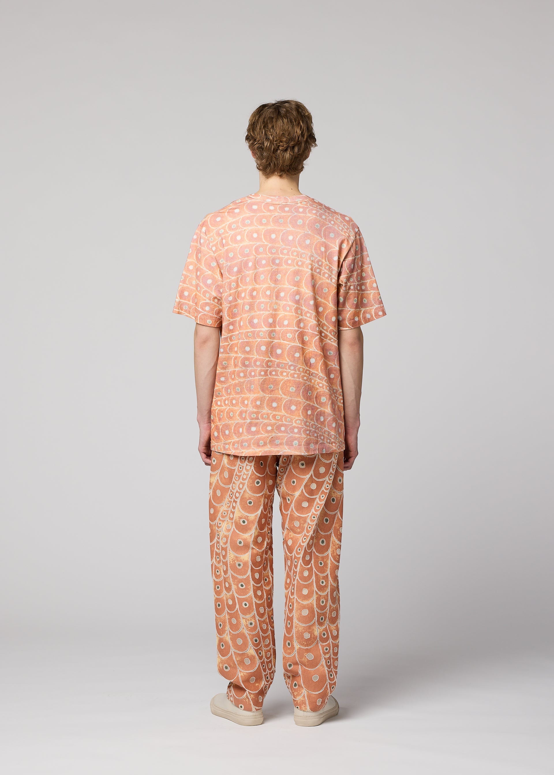 A model wears the IM MEN UROKOMON T top.
