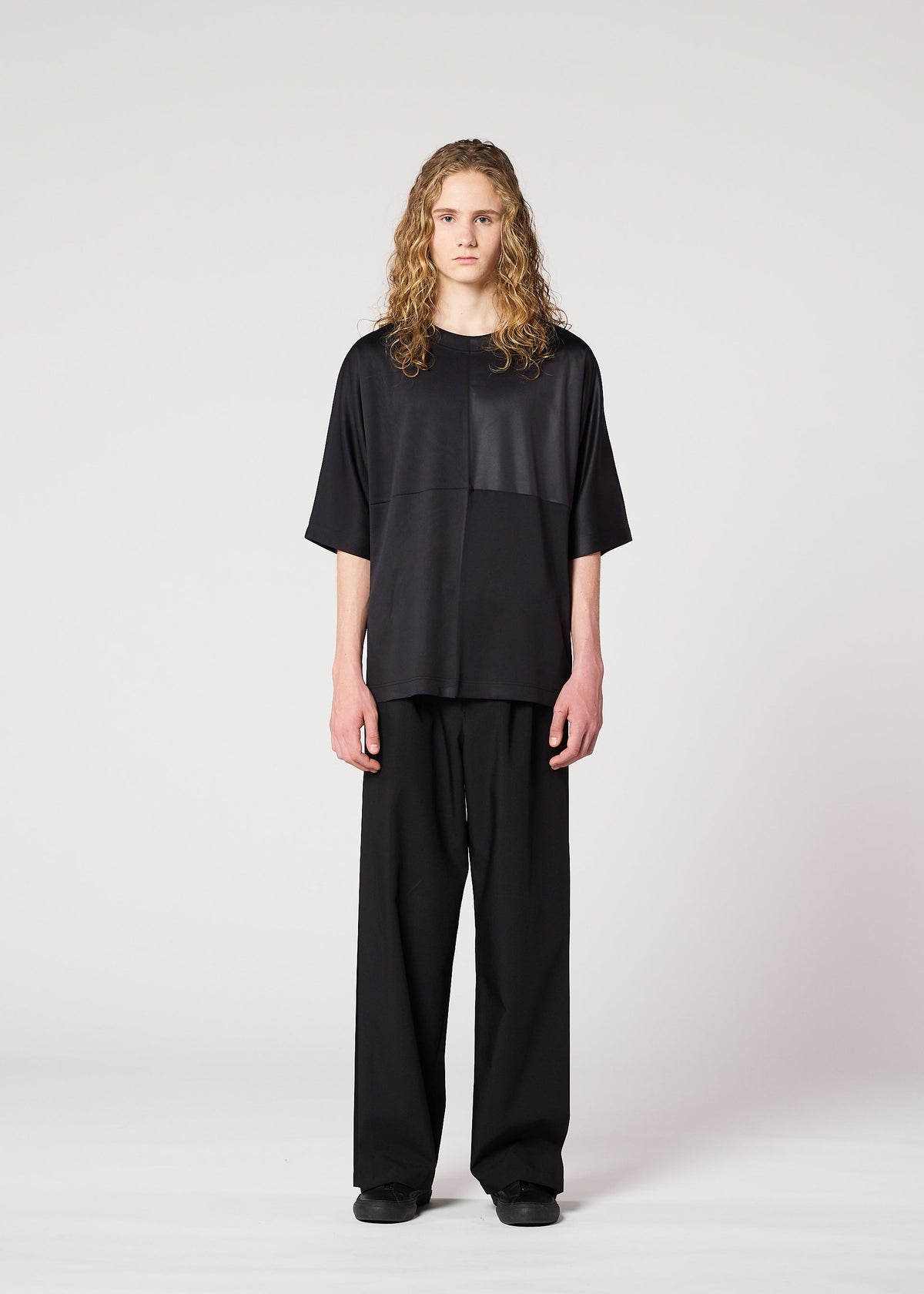 A model wears the IM MEN FLAT T top.