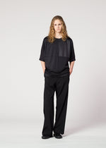 A model wears the IM MEN FLAT T top.