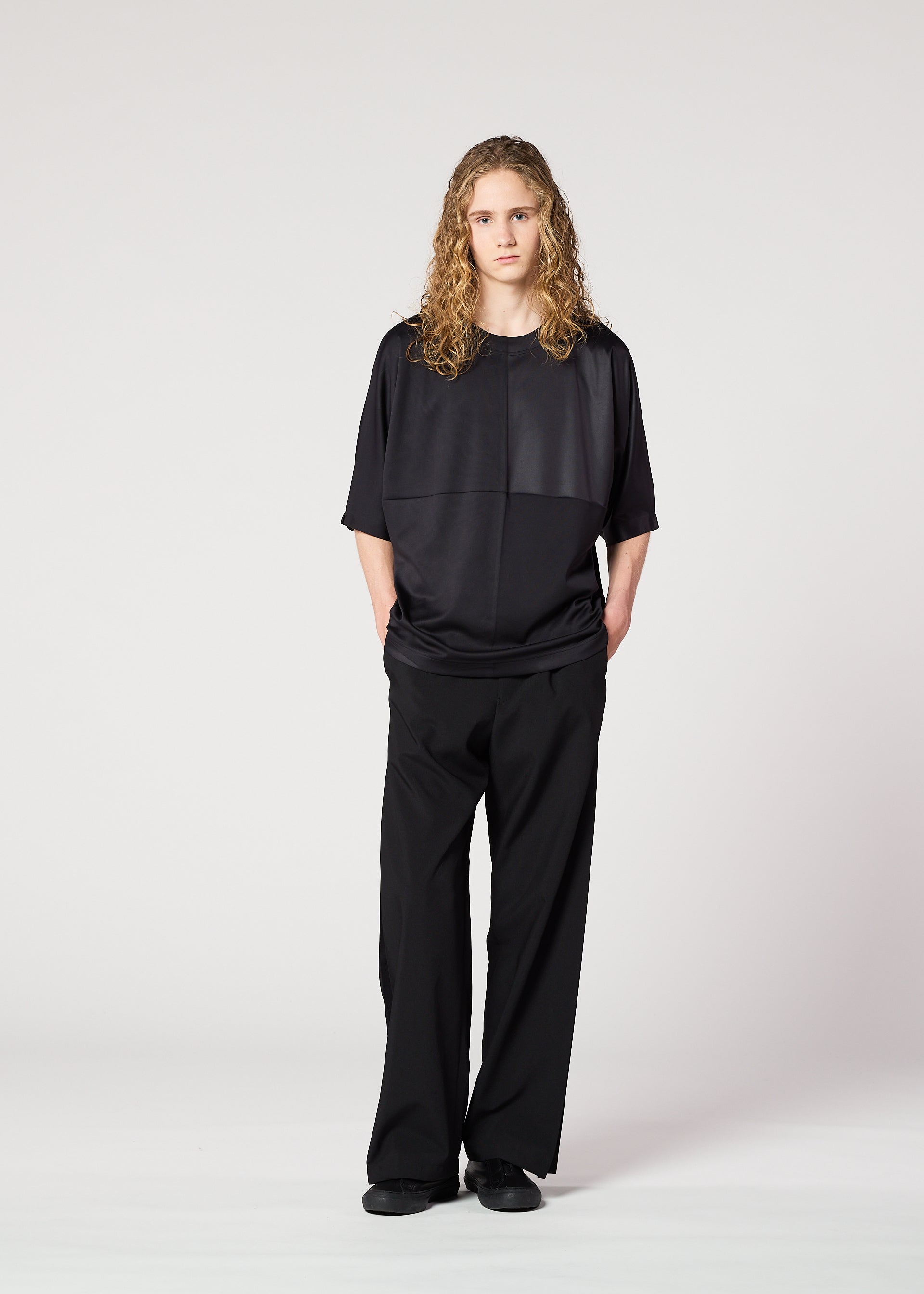 A model wears the IM MEN FLAT T top.