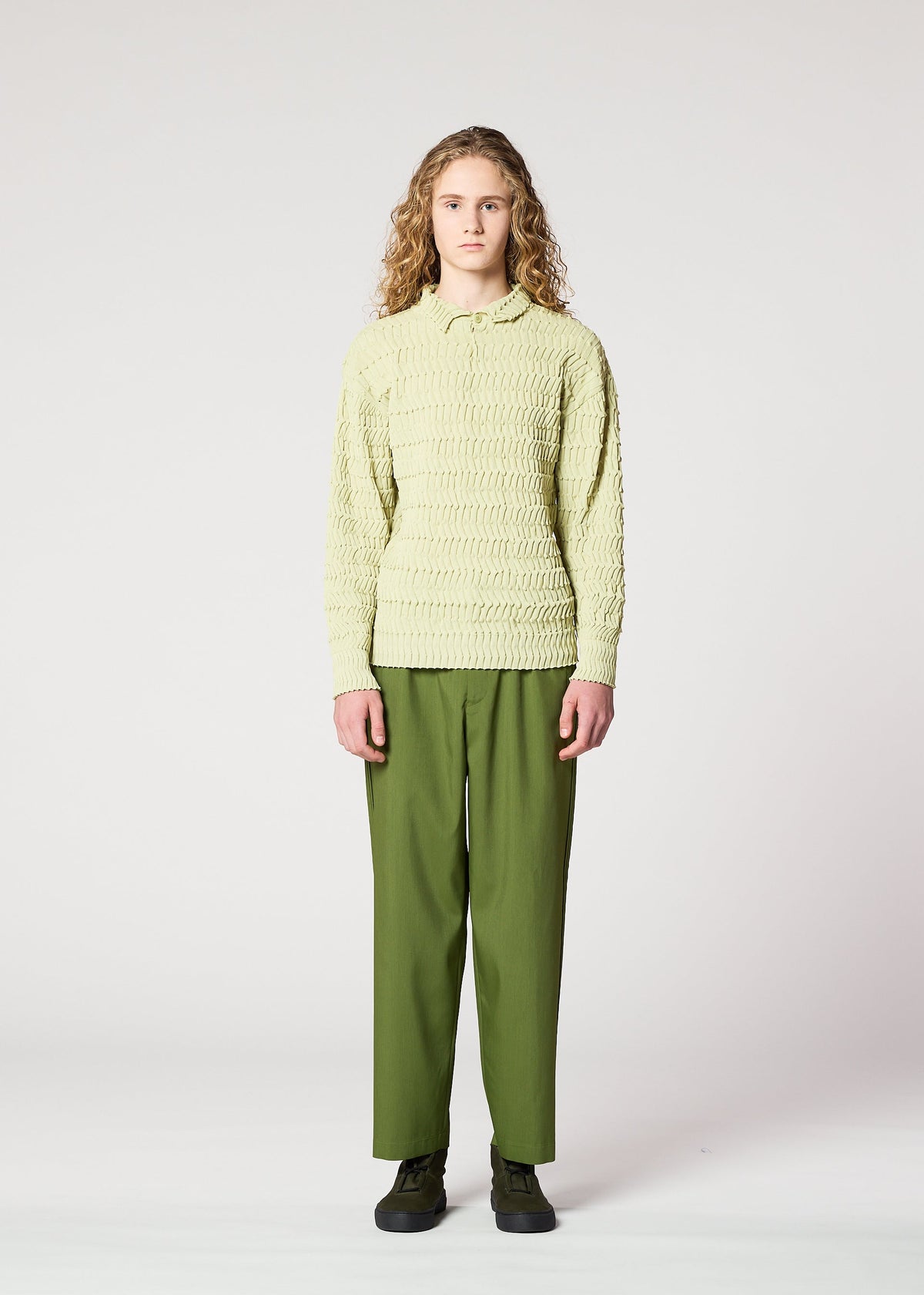 A model wears the IM MEN ZIG ZAG RIB KNIT top.