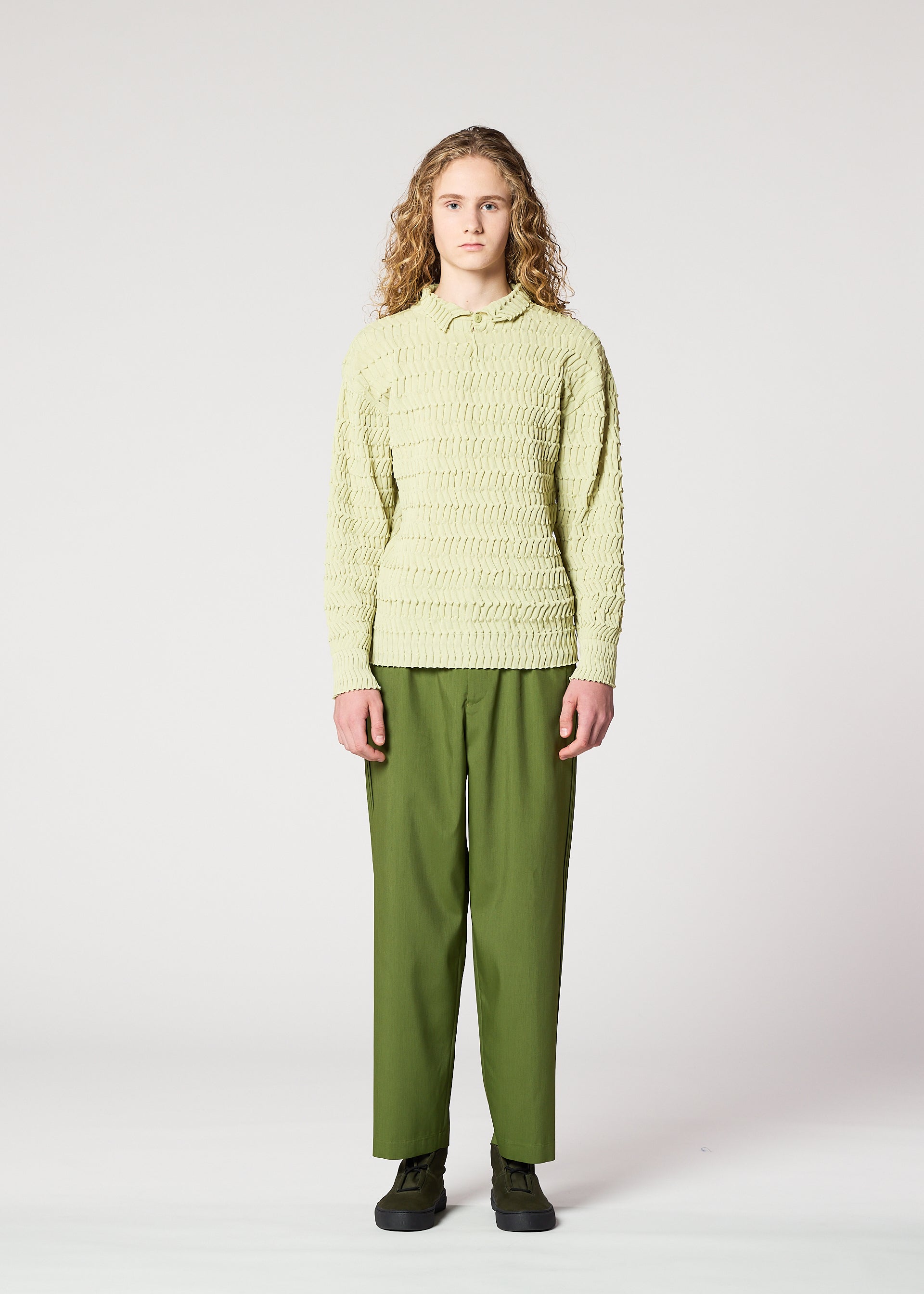 A model wears the IM MEN ZIG ZAG RIB KNIT top.