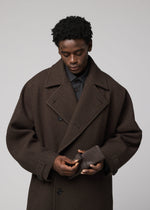 A model wears the IM MEN PATA PA pata-pa-tote-black.