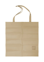 A product shot of the IM MEN PATA PA tote in beige.