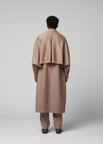 A model wears the IM MEN FRONT BACK front-back-coat-black.