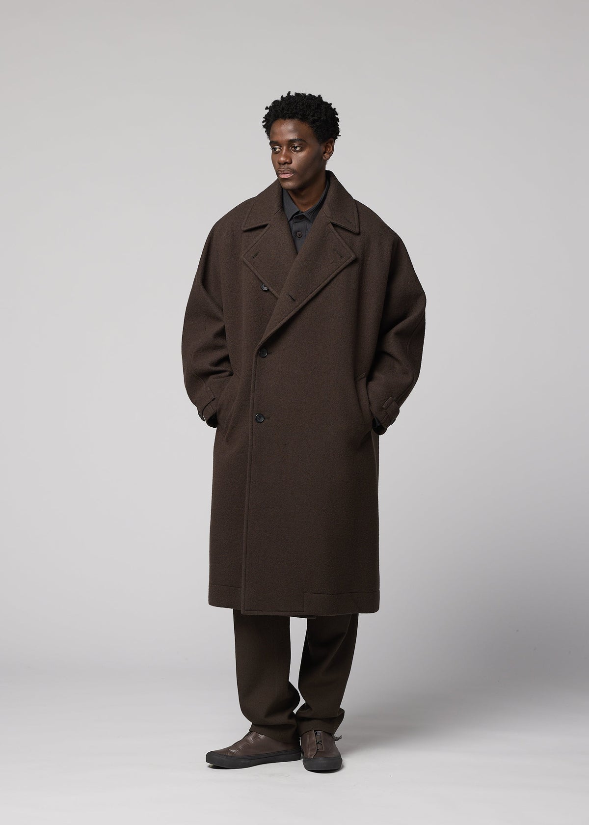A model wears the IM MEN FULLER WOOL fuller-wool-coat-black.