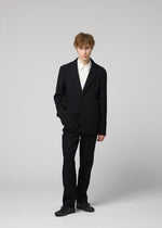 A model wears the IM MEN SHRINK WOOL shrink-wool-single-breasted-jacket-black.