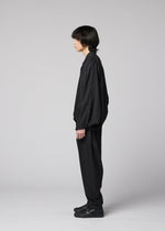 A model wears the IM MEN SWING BLACK swing-black-trousers-black.