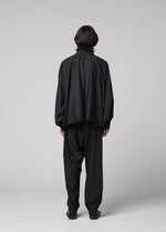 A model wears the IM MEN SWING BLACK swing-black-trousers-black.