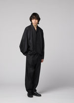 A model wears the IM MEN SWING BLACK swing-black-trousers-black.