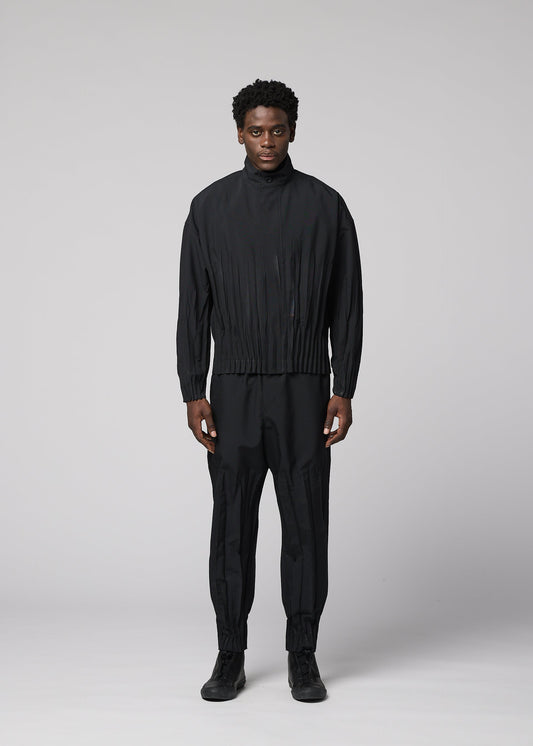 A model wears the IM MEN WAFT BLACK waft-black-trousers-black-1.