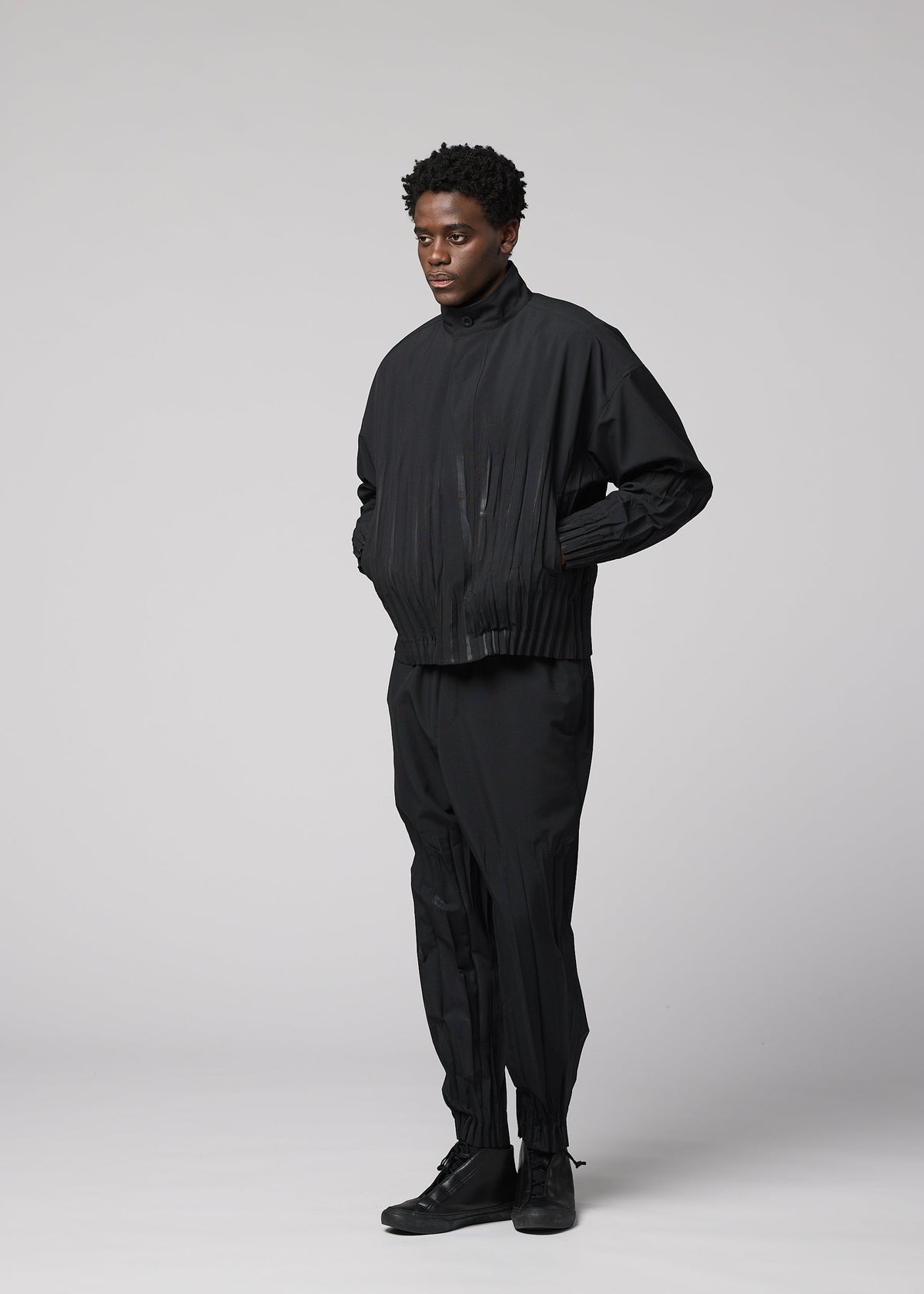 A model wears the IM MEN WAFT BLACK waft-black-trousers-black-1.