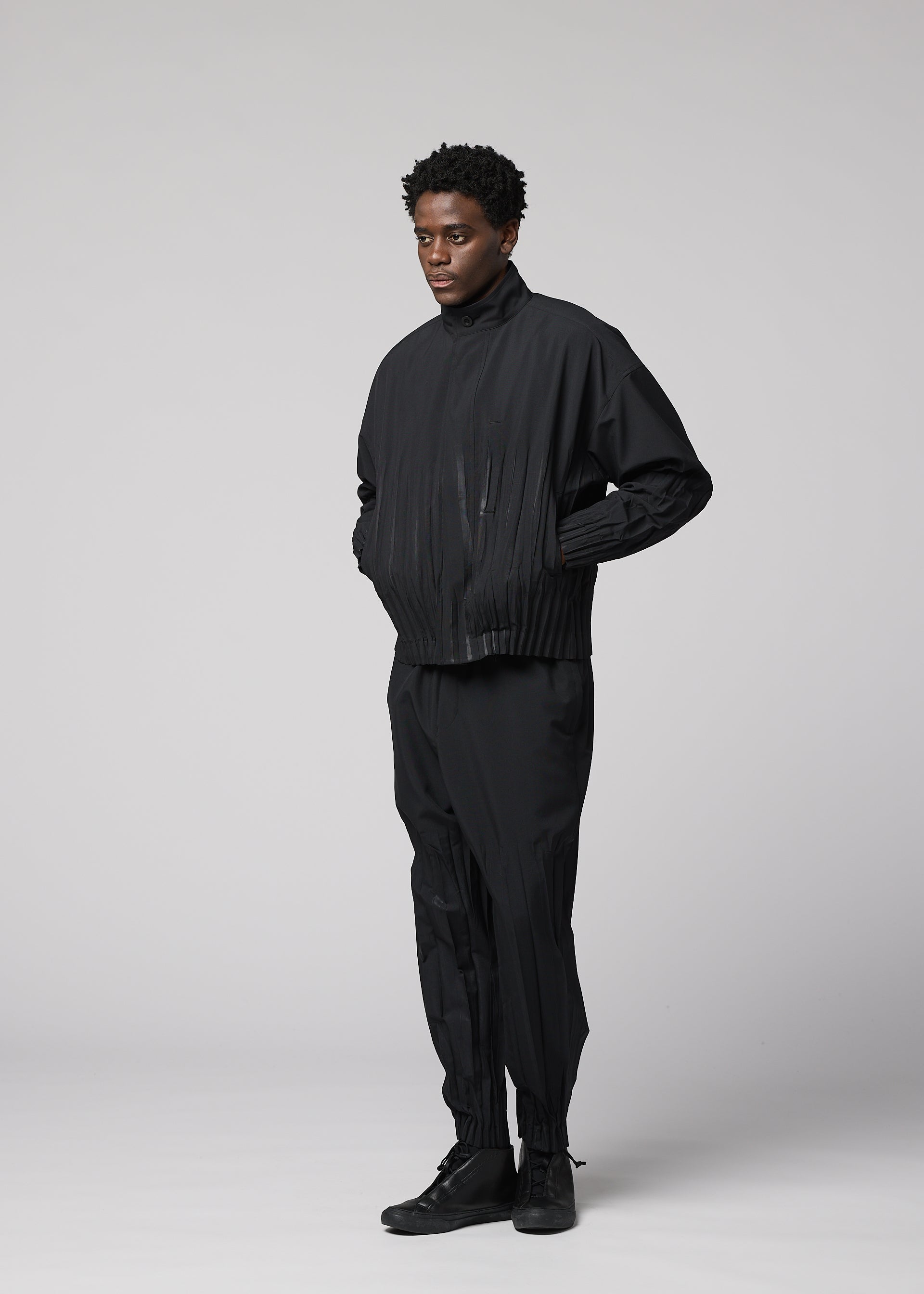 A model wears the IM MEN WAFT BLACK waft-black-trousers-black-1.