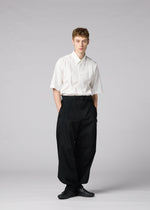 A model wears the IM MEN CLAY clay-trousers-black.