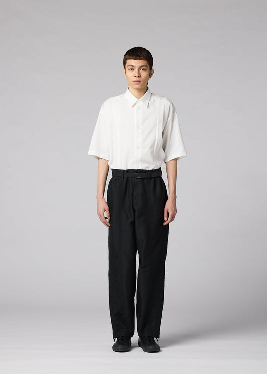 A model wears the IM MEN CLAY clay-trousers-white-1.