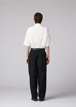 A model wears the IM MEN CLAY clay-trousers-white-1.