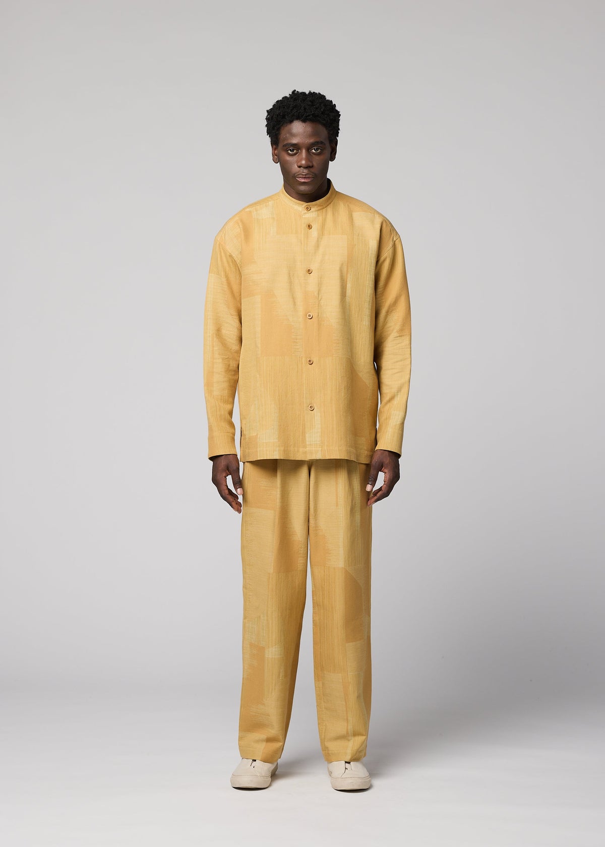 A model wears the IM MEN KASURI kasuri-straight-leg-trousers-black.