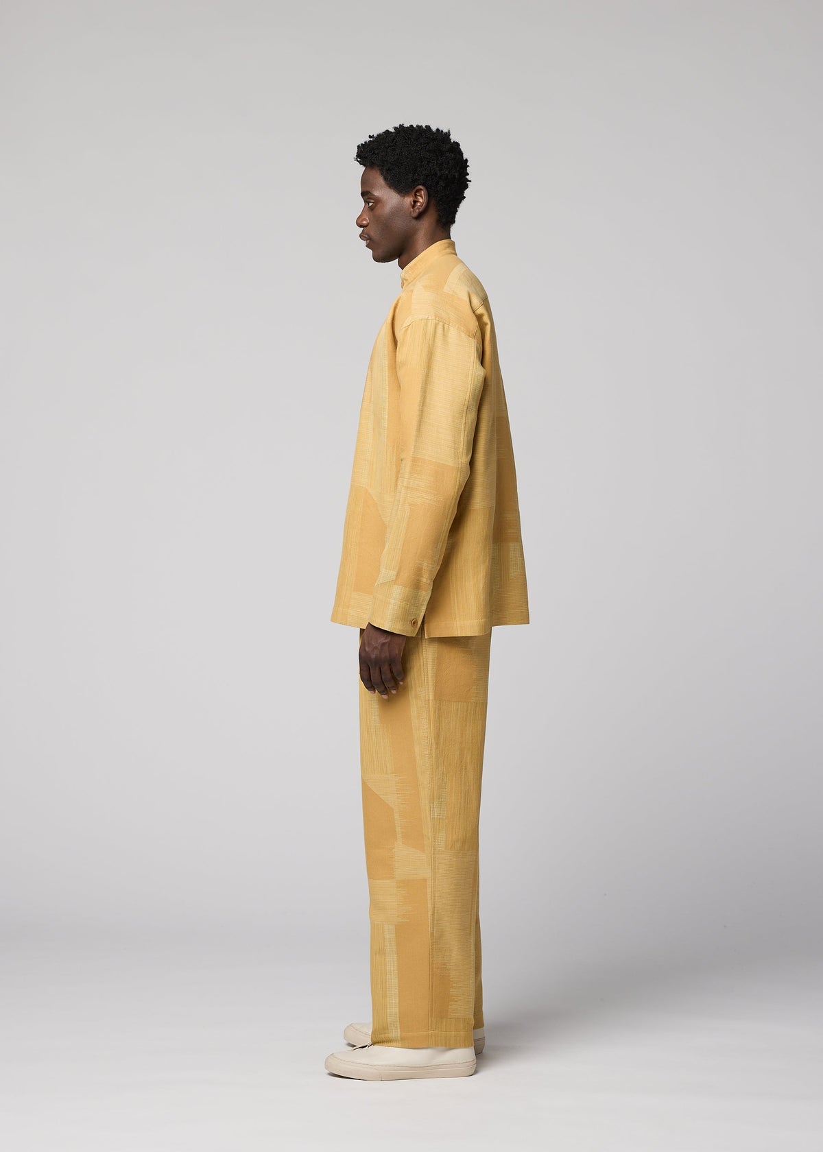 A model wears the IM MEN KASURI kasuri-straight-leg-trousers-black.