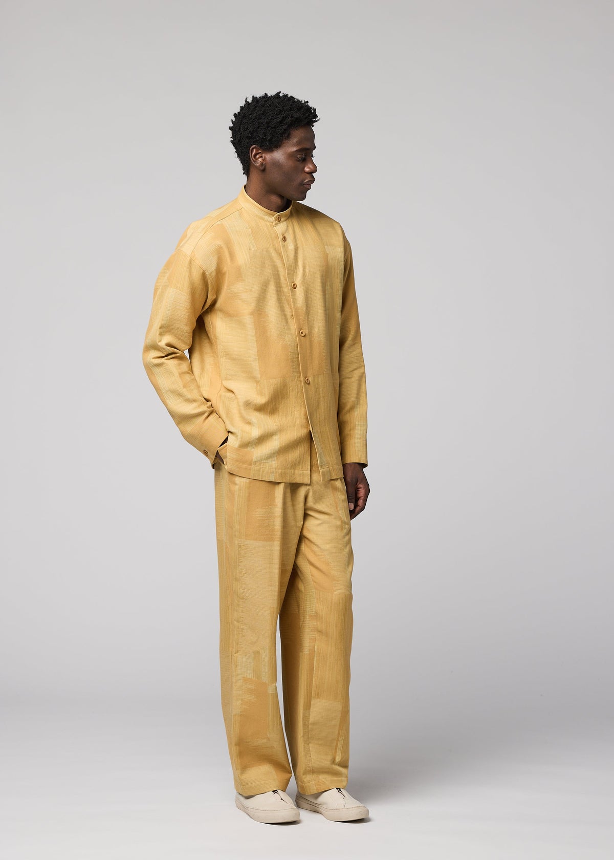 A model wears the IM MEN KASURI kasuri-straight-leg-trousers-black.