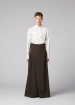 A model wears the IM MEN SHRINK WOOL shrink-wool-trousers-black.