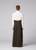 A model wears the IM MEN SHRINK WOOL shrink-wool-trousers-black.