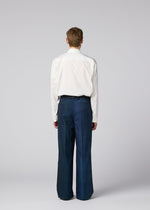 A model wears the IM MEN GRADATION WOOL gradation-wool-straight-leg-trousers-black.