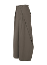 A detail shot of the IM MEN OVERLAP trousers.