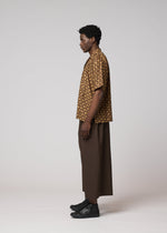 A model wears the IM MEN TIE PATTERN SHIRT tie-pattern-shirt-shirt-dark-brown.