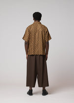 A model wears the IM MEN TIE PATTERN SHIRT tie-pattern-shirt-shirt-dark-brown.