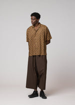 A model wears the IM MEN TIE PATTERN SHIRT tie-pattern-shirt-shirt-dark-brown.