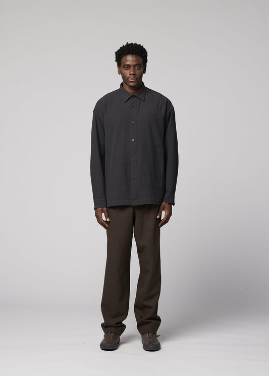 A model wears the IM MEN DOUBLE WEAVE CREPE double-weave-crepe-shirt-blue.