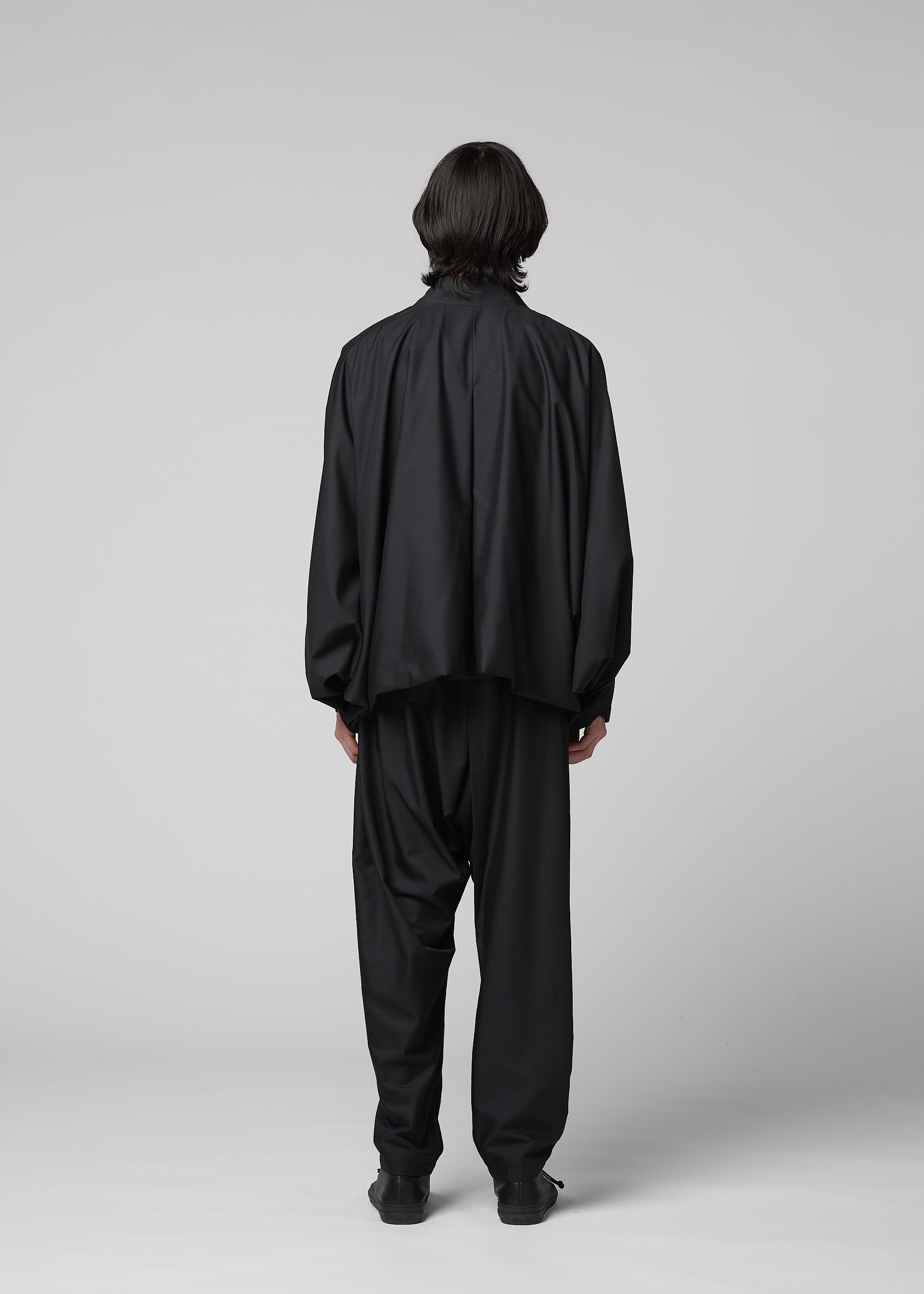 A model wears the IM MEN SWING BLACK swing-black-jacket-black.