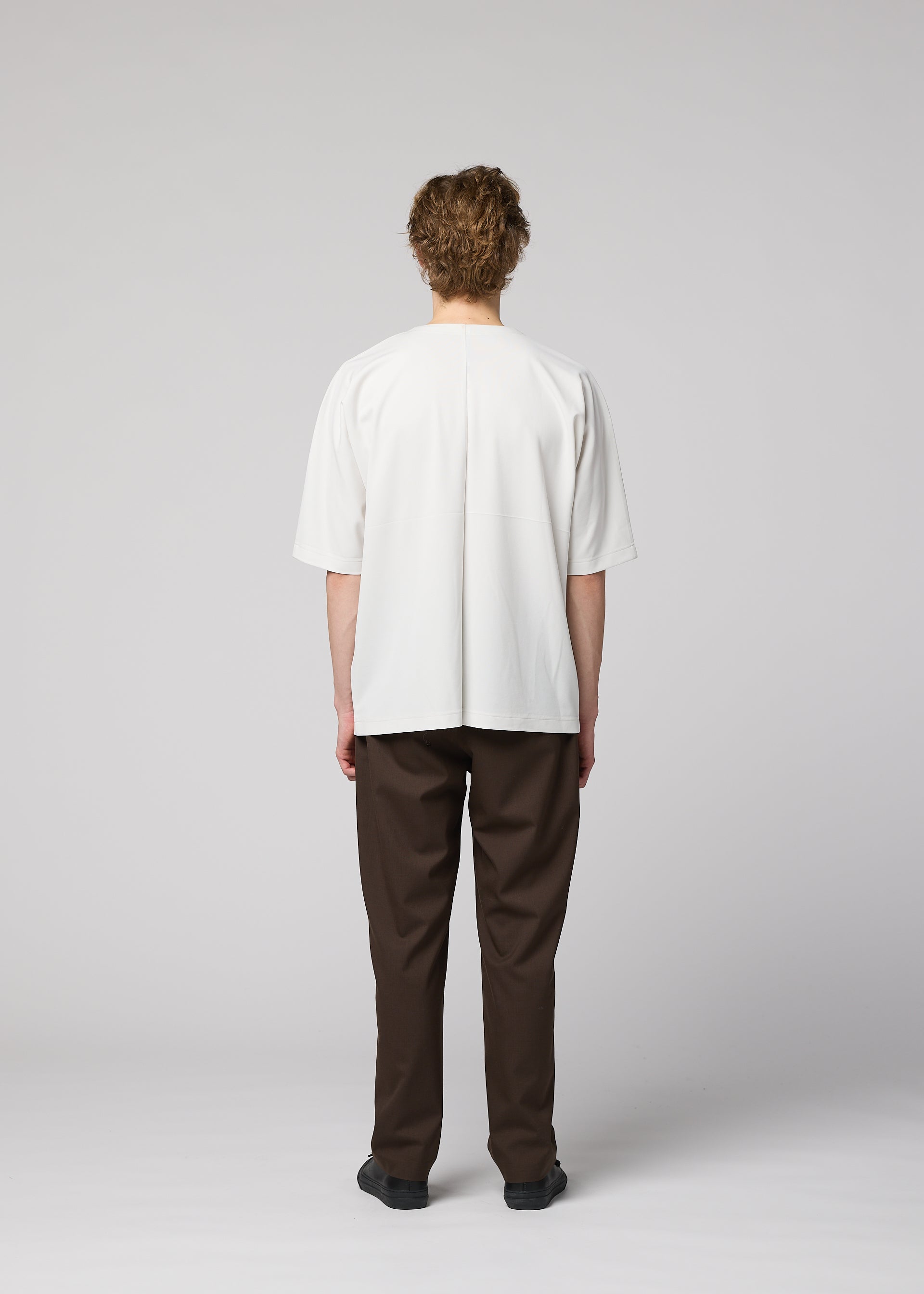 A model wears the IM MEN FLAT T top.